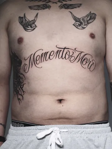 Fotografia real de un tatuaje lettering en Arkadia